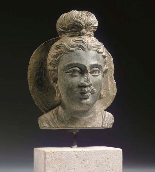 A Gandhara grey schist head of Buddha Sakyamuni