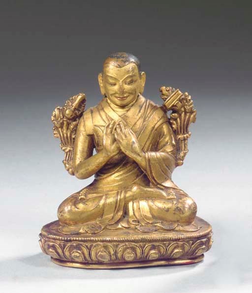 A Tibetan gilt-bronze figure of possibly Tsong.kha.pa