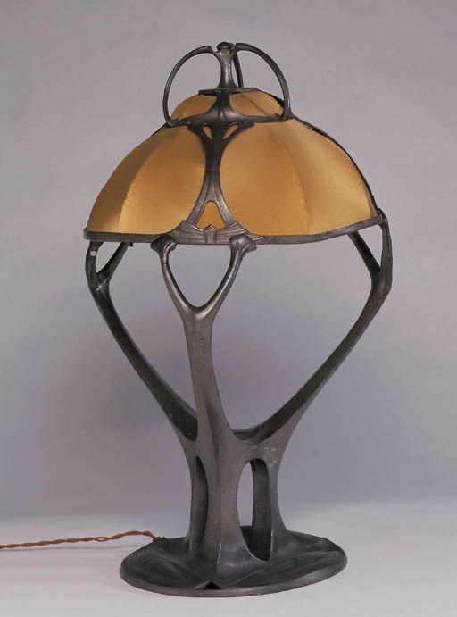 AN ART NOUVEAU PEWTER 'OSIRIS' TABLE LAMP