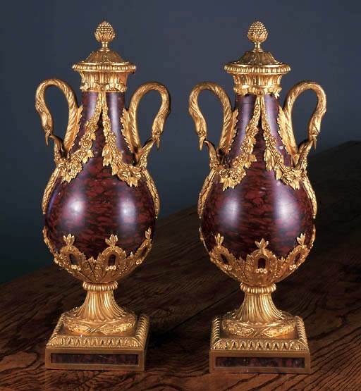 A PAIR OF ORMOLU MOUNTED ROUGE MARBLE CASSOLETTES