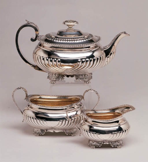 A GEORGE III STERLING SILVER THREE PIECE TEA SET