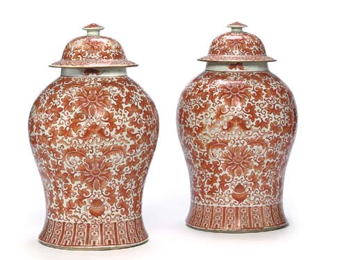 A PAIR OF CHINESE IRON-RED-DECORATED BROAD BALUSTER JARS AND DOMED COVERS