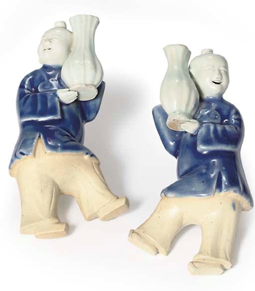 A PAIR OF CHINESE BLUE AND WHITE-GLAZED WALL VASES
