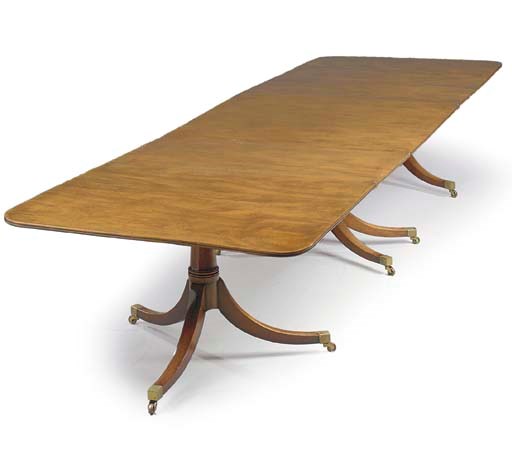 A MAHOGANY THREE-PEDESTAL DINING-TABLE
