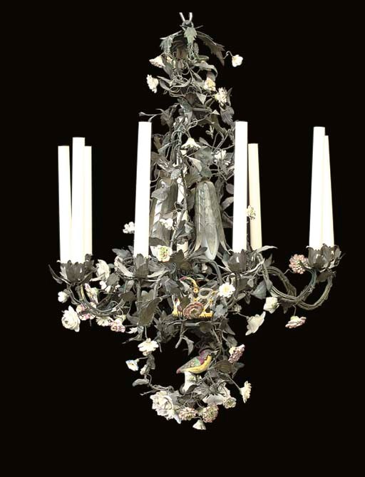 A GREEN PAINTED TOLE AND SOFT-PASTE PORCELAIN NINE-LIGHT CHANDELIER