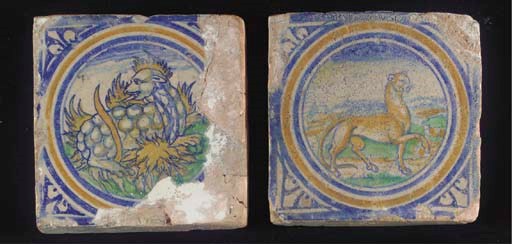 A pair of Antwerp polychrome animal medallion tiles