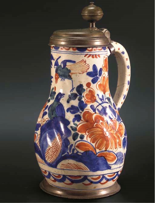 A Dutch Delft polychrome pewter-mounted jug