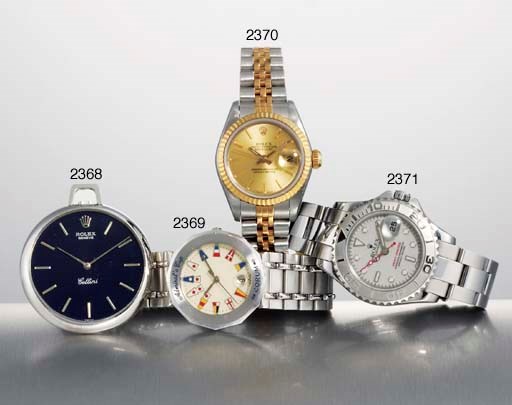 CORUM. A LADY'S 18K WHITE GOLD DODECAHEDRAL WRISTWATCH WITH SWEEP CENTRE SECONDS, DATE AND BRACELET