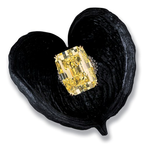 A MAGNIFICENT COLOURED DIAMOND AND DIAMOND RING, BY HARRY WINSTON