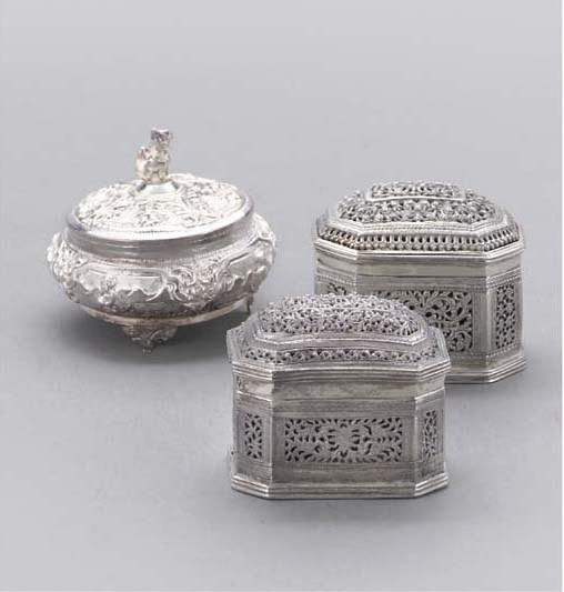 A COLLECTION OF THIRTEEN BURMESE SILVER AND SILVERED METAL TRINKET BOXES