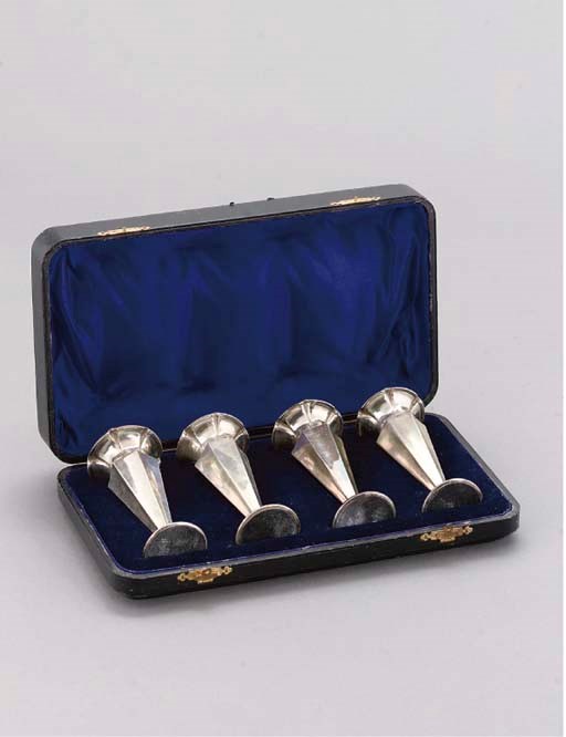 A SET OF FOUR CASED ROSE VASES
