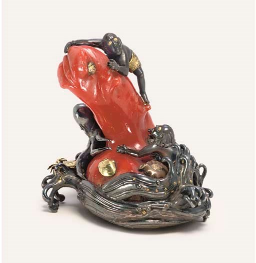 A SILVER AND CORAL OKIMONO STYLE NETSUKE