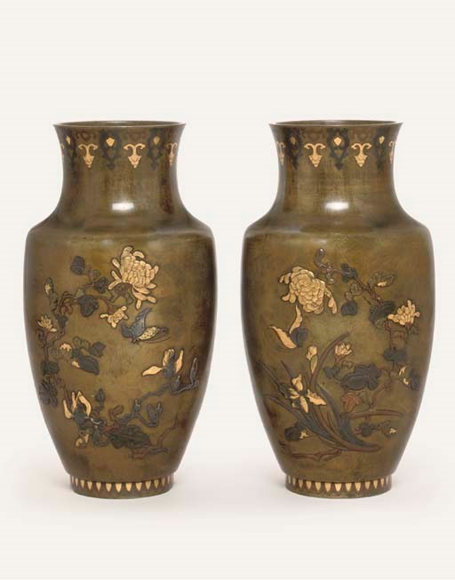A pair of bronze vases