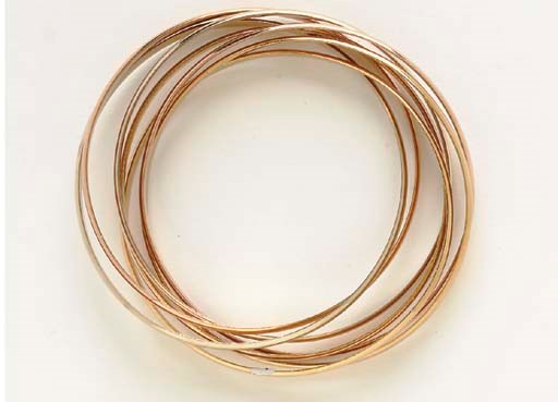 AN 18K TRI0COLORED GOLD ROLLING BRACELET, BY CARTIER