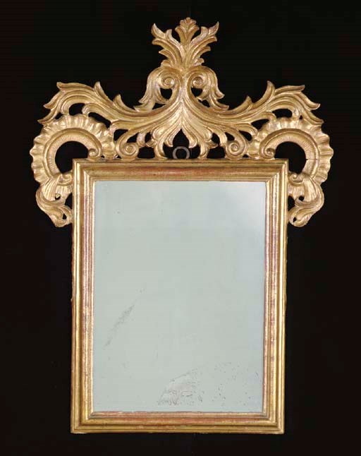 A CONTINENTAL ROCOCO GILTWOOD MIRROR,