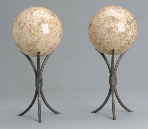 A PAIR OF FOSSIL MARBLE SPHERES ON WROUGHT-IRON STANDS,
