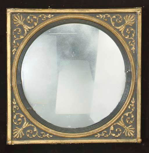 A CONTINENTAL PARCEL-GILT AND EBONIZED CONVEX MIRROR,