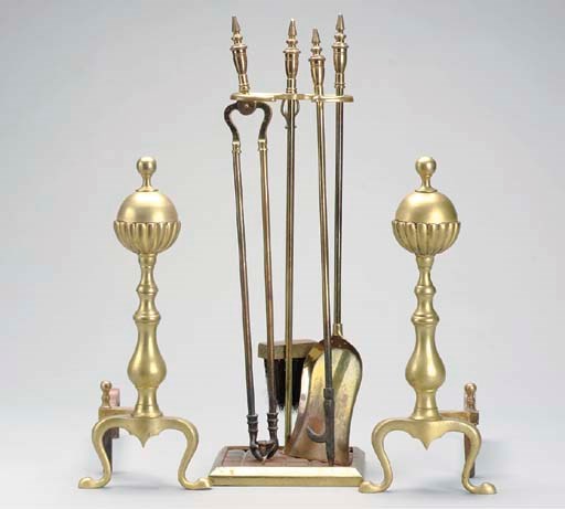 A PAIR OF BRASS ANDIRONS TOGETHER WITH A FIRESCREEN AND A SET OF TOOLS,