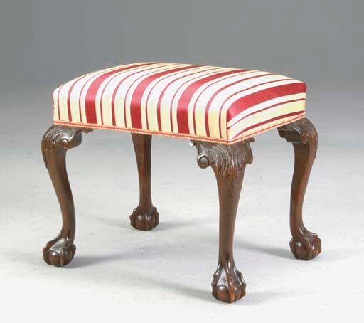 A GEORGE II STYLE MAHOGANY STOOL COVERED IN STRIPED SILK UPHOLSTERY,