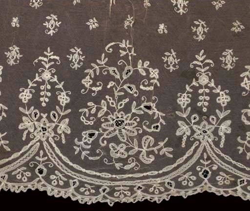 A VEIL AND FLOUNCE OF BRUSSELS LACE