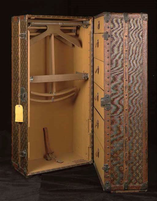 A LOUIS VUITTON TRAVELLING TRUNK