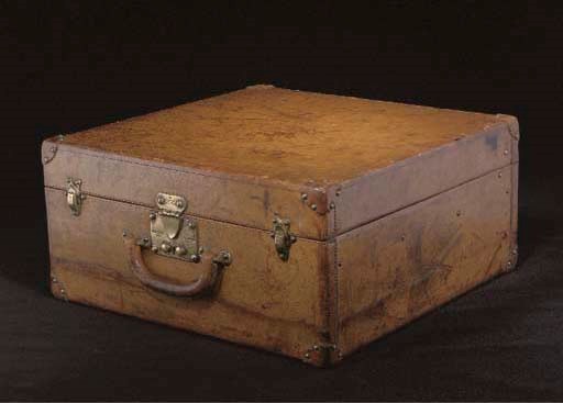 A SQUARE LEATHER SUITCASE BY LOUIS VUITTON