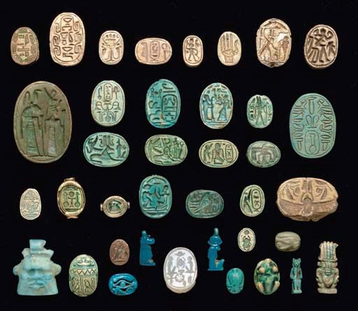 A GROUP OF EGYPTIAN SCARABS AND AMULETS