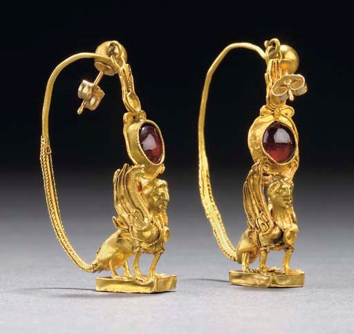 A PAIR OF GREEK GOLD AND GARNET EARRINGS