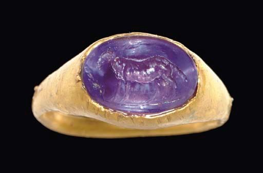 A ROMAN GOLD AND AMETHYST FINGER RING