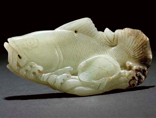 A celadon and russet jade carving of a fish, 17th/18th Century