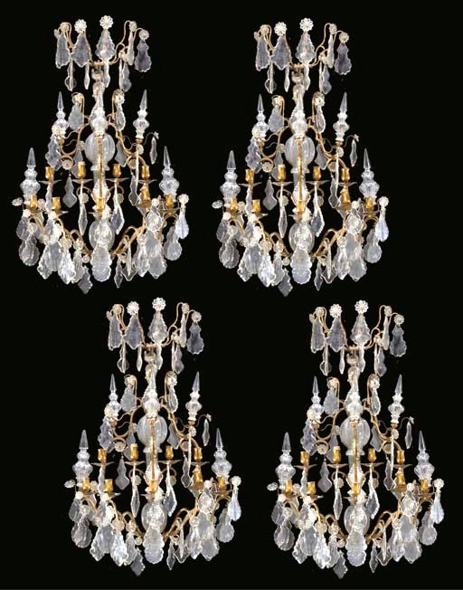 SUITE DE QUATRE APPLIQUES DE STYLE LOUIS XV