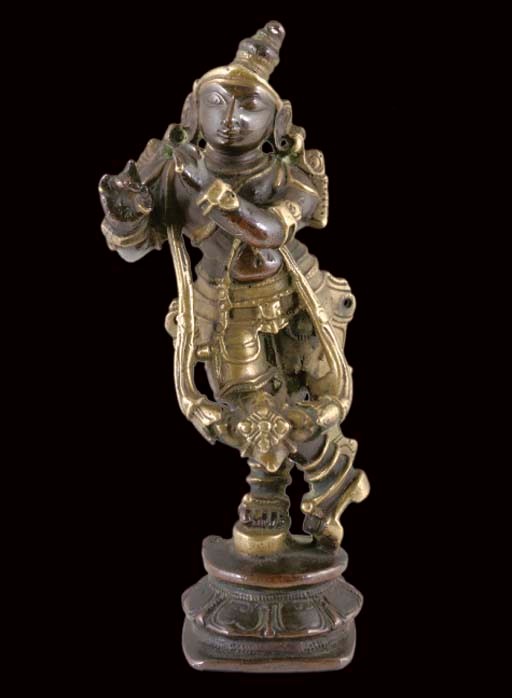 A PATINATED BRASS MODEL OF KRISHNA, INDIA, 18TH CENTURY