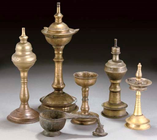 Five Indian brass lamps, 18th/19th century