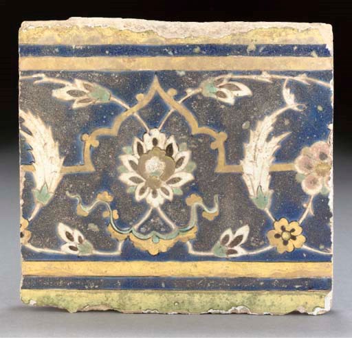 A Mughal cuerda seca pottery border tile, India, 17th century
