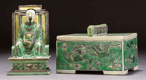 A famille verte biscuit model of a seated dignitary, Kangxi