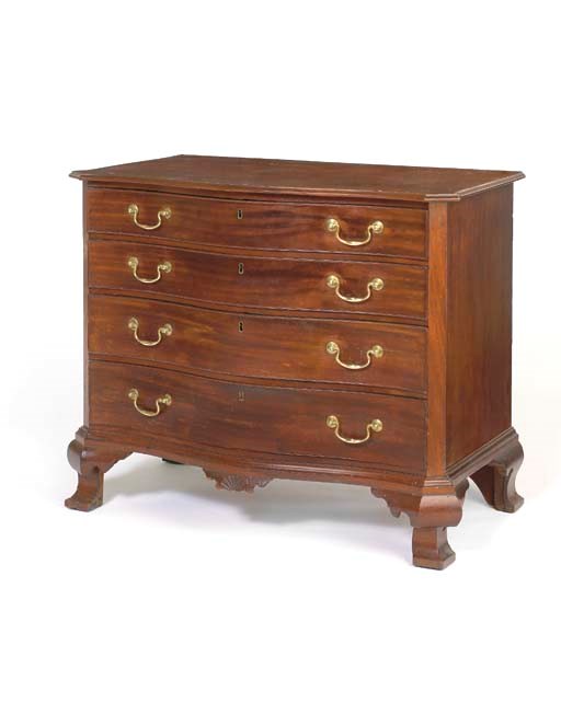 A CHIPPENDALE MAHOGANY SERPENTINE-FRONT CHEST-OF-DRAWERS