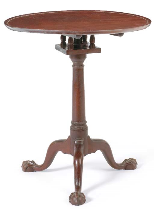 A CHIPPENDALE MAHOGANY TILT-TOP CANDLE STAND