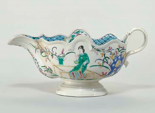 A STAFFORDSHIRE SALTGLAZED STONEWARE CHINOISERIE SAUCEBOAT