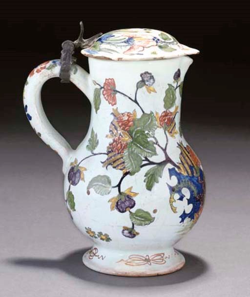 A FRENCH FAIENCE BALUSTER JUG AND COVER WITH HINGED PEWTER MOUNT