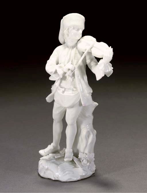 A MEISSEN WHITE FIGURE OF A BALLAD SELLER