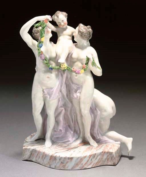 A KLOSTER VEILSDORF GROUP OF THE THREE GRACES AND A PUTTO