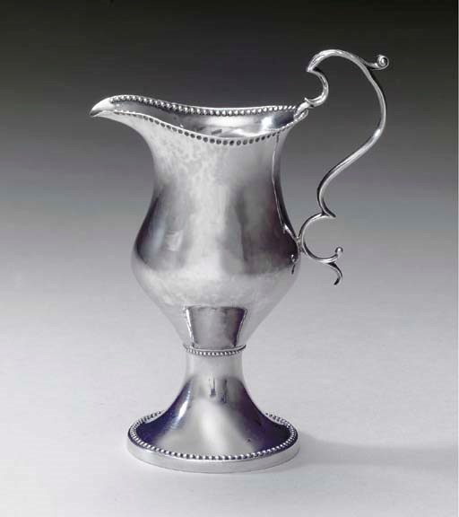 A SILVER CREAM JUG