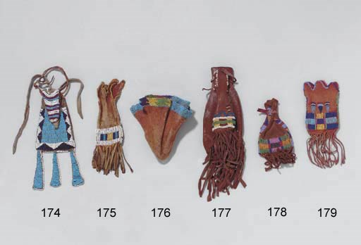 A PAIR OF PLAINS BEADED HIDE POUCHES