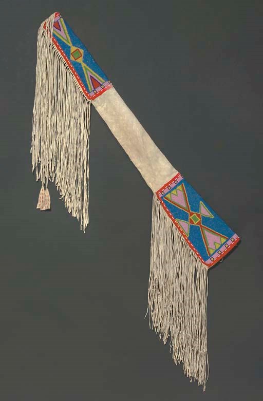 AN ASSINIBOIN BEADED AND FRINGED HIDE RIFLE SCABBARD