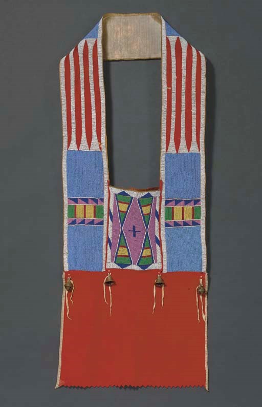 A PLATEAU BEADED BUFFALO HIDE AND CLOTH BANDOLIER BAG
