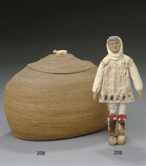 AN ESKIMO COILED BASKET**