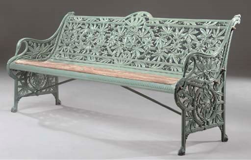 A VICTORIAN CAST IRON SEAT OF 'PASSION FLOWER' DESIGN
