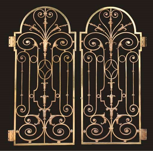 A PAIR OF VICTORIAN BRASS SCREEN GATES