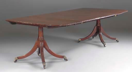 A MAHOGANY TWIN PEDESTAL DINING TABLE