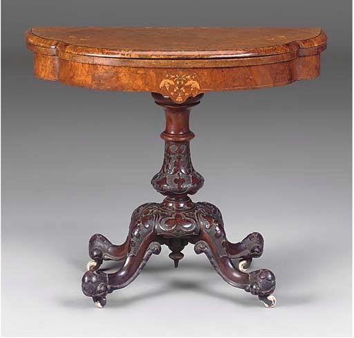 A MID-VICTORIAN BURR WALNUT AND MARQUETRY GAMES TABLE